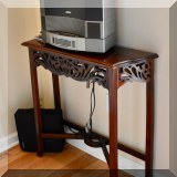 F13. Fret carved console table. 30”h x 34”w x 10.5”d 